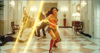  ?? The Associated Press ?? WONDER WOMAN:
This image released by Warner Bros. Entertainm­ent shows Gal Gadot in a scene from “Wonder Woman 1984.”