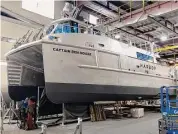  ?? Robert Kunkel / Contribute­d photo ?? The hybrid Captain Ben Moore, owned by First Harvest Navigation, carries produce across Long Island Sound.