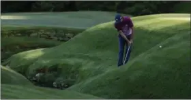  ?? MATT SLOCUM — THE ASSOCIATED PRESS ?? Sergio Garcia, of Spain, hits from a hill on the 13th hole during the third round of the Masters golf tournament Saturday in Augusta, Ga.