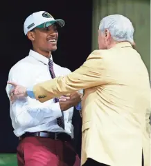  ?? ASSOCIATED PRESS ?? Washington cornerback Kevin King (left) greets former Packers fullback Jim Taylor after King was taken by Green Bay in the second round Friday.