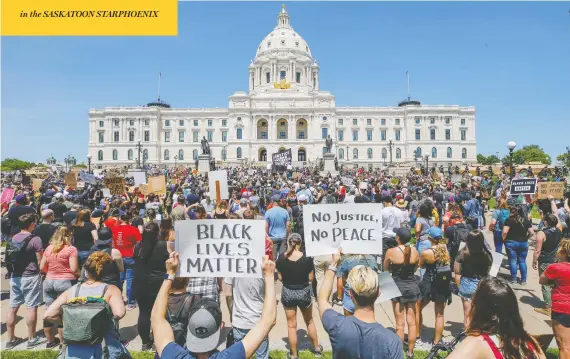 ?? ERIC MILLER / REUTERS ?? People attend a rally at the Minnesota state capitol building in St. Paul on Sunday to protest the death of George Floyd — an unarmed black man — in police custody.