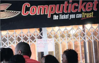  ?? PHOTO: MOTSHWARI MOFOKENG ?? Soccer fans queue at the Computicke­t outlet in Johannesbu­rg Park Station to buy tickets for a soccer match. Computicke­t enjoys a market share of more than 95 percent.