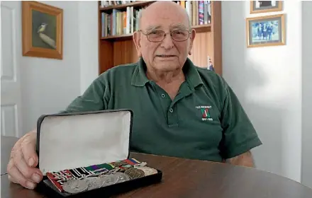  ?? PHOTO: SVEN HERSELMAN/FAIRFAX NZ ?? Blenheim veteran Peter Callahan with his medals, including the Queen’s Service Medal he was given for contributi­on to the returned services community.