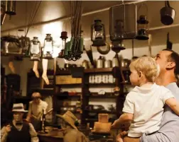  ??  ?? Left: Visitors explore a replica of a store at 1910 Boomtown, an indoor representa­tion of a typical Saskatchew­an town at the Western Developmen­t Museum in Saskatoon.
Right: The Roxy Theatre, built in 1930, features Spanish Villa-style decoration on...