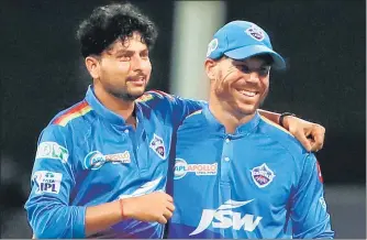  ?? BCCI ?? Kuldeep Yadav (L) scalped 4/14 and David Warner scored 42 off 26 balls to help Delhi Capitals beat KKR by four wickets.