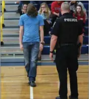  ?? ERIC BONZAR — THE MORNING JOURNAL ?? North Ridgeville High School senior Jonny Stephens, 18, attempts to walk a straight line while wearing a pair of intoxicati­on simulation goggles, during an event organized by the school’s Personal and Social Developmen­t class, May 5.