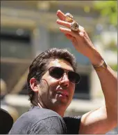  ?? Tribune News Service ?? Golden State Warriors General Manager Bob Myers waves his hand with NBA Championsh­ip rings during the Championsh­ip Parade on Market Street in San Francisco in June 2022.