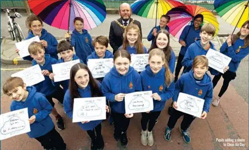  ??  ?? Pupils adding a sheen to Clean Air Day