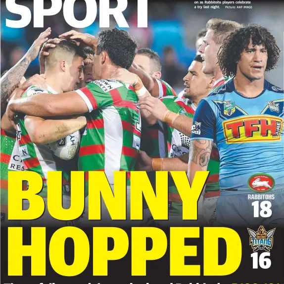  ?? Picture: AAP IMAGE ?? Titan Kevin Proctor can only look on as Rabbitohs players celebrate a try last night.