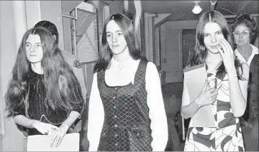  ?? Associated Press ?? PATRICIA KRENWINKEL, left, Susan Atkins and Leslie Van Houten enter court on Feb. 11, 1971, during the penalty phase of their trial. The women were convicted in the murder of actress Sharon Tate in 1969.