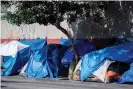  ?? Photograph: Robyn Beck/ AFP/Getty Images ?? Tents line the street in the Skid Row area of Los Angeles.