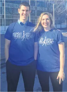  ?? BRENDAN AHERN/THE NEWS ?? Dr. Brad MacDougall and Active Pictou County co-ordinator Sally O’Neill sporting Walk with a Doc T-shirts outside the Pictou County Wellness Centre.