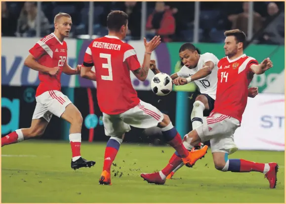  ?? EPA ?? Kylian Mbappe, second from right, scored two goals for France as the visitors beat 2018 World Cup hosts Russia 3-1 in a friendly at the Zenit Arena in St Petersburg last night. Mbappe’s strikes were sandwiched by a goal from Paul Pogba, who also had an...