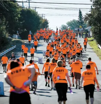  ??  ?? Chaque mois de septembre, des centaines de personnes participen­t ici au Defi Everest, en grimpant 150 fois en haut de cette côte urbaine de Rivière-du-Loup.