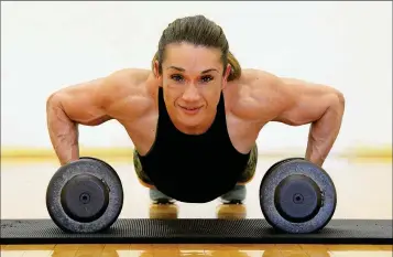  ?? Buy these photos at YumaSun.com PHOTOS BY RANDY HOEFT/YUMA SUN ?? CLAUDIA DIAZ (ABOVE AND BELOW) works out at the Fourth Avenue Gym. Diaz is a profession­al body builder with aspiration­s of someday going to Olympia, which is the Super Bowl of body building.