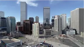  ?? Hyoung Chang, The Denver Post ?? Nearly-empty streets and parking spaces is seen in downtown Denver in March as many moved their work to their homes to counter the spread of the novel coronaviru­s.