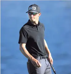  ?? - AFP photo ?? Brandon Hagy finishes his round on the 18th green during the first round of The American Express tournament on the Jack Nicklaus Tournament Course at PGA West in La Quinta, California.