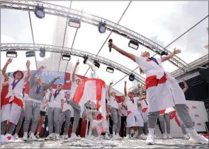  ?? The Associated Press ?? England players celebrate on stage at an event at Trafalgar Square in London on Monday. England beat Germany 2-1 and won the final of the Women’s Euro 2022 on Sunday.