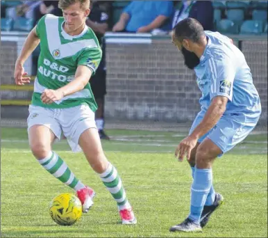  ?? Picture: Paul Amos FM4915777 ?? Ashford striker Matt Day looks to get away from the Molesey defence