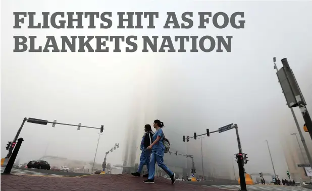  ?? Photos by Ryan Lim, Leslie Pableo, Dhes Handumon and Neeraj Murali ?? Residents make their way as fog blankets Abu Dhabi on Saturday morning. The foggy conditions are expected to continue till Sunday. —