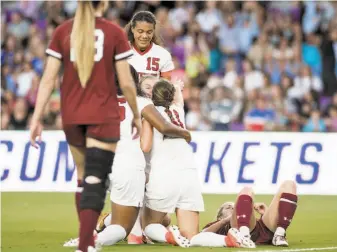  ?? StanfordPh­oto ?? Stanford midfielder Jordan DiBiasi (11) celebrates with teammates including Alana Cook (15) on Friday in Orlando after scoring the first of her two goals in the win over South Carolina.