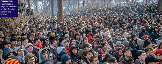  ??  ?? CROWDS: Hundreds of asylum seekers on the Turkish side of the border