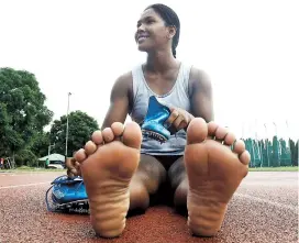  ??  ?? Swapna Barman, the women’s heptathlon gold medal winner at the Asian Games in Jakarta, despite having 12 toes. — Reuters