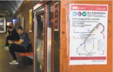  ??  ?? Signs posted at Muni stations alert riders about the tunnel closure and suggest alternate modes of transporta­tion.