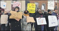  ?? MARIA DANILOVA / AP ?? Protesters gather outside Jefferson Middle School in Washington, D.C., on Friday where Education Secretary Betsy DeVos paid her first visit.