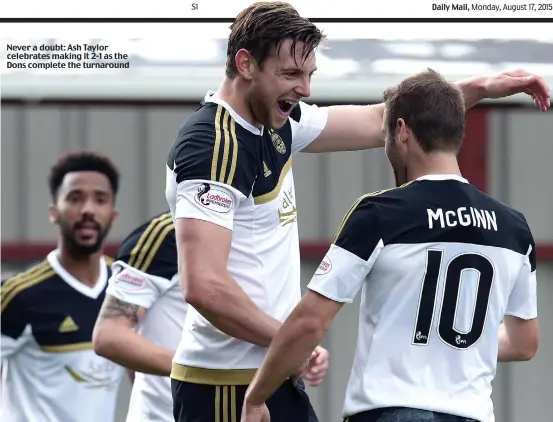  ??  ?? Never a doubt: Ash Taylor celebrates making it 2-1 as the Dons complete the turnaround