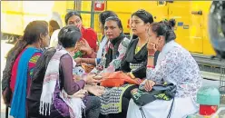  ?? DEEPAK GUPTA / HT PHOTO ?? Parents waiting for their wards outside a city school on Wednesday.