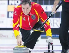  ?? ANDREW VAUGHAN/THE CANADIAN PRESS ?? Nunavut skip David St. Louis delivers a rock during play Sunday at the Brier in Regina.