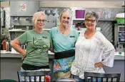  ??  ?? Carrie Rodriguez (right) stands with her sister and coworker Iris Murphy (left) and Nanci Lane at Green’s Pharmacy in Palm Beach.