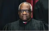  ?? ERIN SCHAFF — THE NEW YORK TIMES VIA AP ?? Justice Clarence Thomas sits during a group photo at the Supreme Court in Washington.