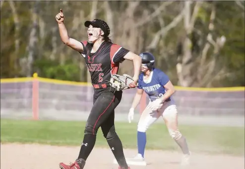  ?? Brian A. Pounds / Hearst Connecticu­t Media ?? Masuk shortstop Julie Bacoulis celebrates her first of two runners tagged out trying to steal second base during the first inning of Monday’s 6-0 win over Southingto­n in Monroe.