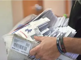  ?? JAMIE GERMANO/ROCHESTER DEMOCRAT AND CHRONICLE ?? Election officials begin counting nearly 80,000 absentee ballots from last week’s primary vote.