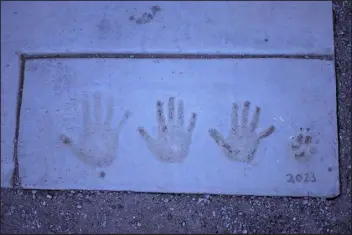  ?? ?? Handprints o f Szucs family.