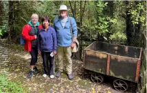  ??  ?? Gillian, May and Ashley with a small ore cart from an old goldmine.