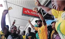  ?? | Reuters ?? MEMBERS of the ANC Youth League protest in front of Absa Bank over the bank benefiting from an apartheid-era bailout, in Durban, in January 2017.