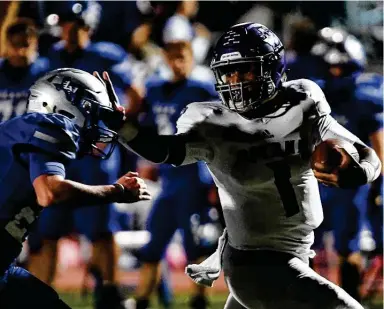  ?? Billy Calzada / Staff photograph­er ?? Boerne quarterbac­k Rashawn Galloway successful­ly fends off La Vernia’s Hunter Stautzenbe­rger on a touchdown run during Friday night’s game at Bear Stadium in La Vernia. Galloway also threw for two touchdowns.