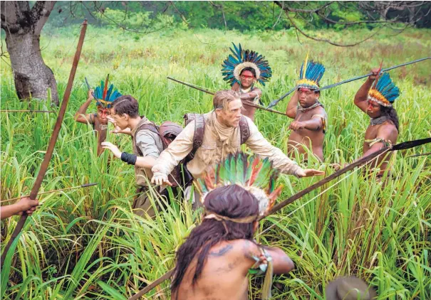  ?? COURTESY OF AMAZON STUDIOS/BLEECKER STREET ?? Tom Holland, center left, and Charlie Hunnam, center, in a scene from “The Lost City of Z.”