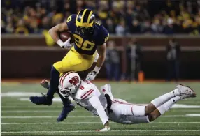  ?? Paul Sancya ?? The Associated Press Michigan and WR Oliver Martin (80), who face Michigan State on Saturday, own a sixgame win streak after opening with a loss at Notre Dame