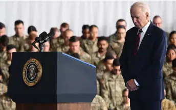  ?? — AFP photo ?? Biden bows his head during remarks to service members, first responders, and their families on the 22nd anniversar­y of the Sept 11, 2001, terrorist attacks, at Joint Base Elmendorf-Richardson in Anchorage, Alaska.