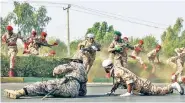  ??  ?? BLOODY: Iranian soldiers run for cover as gunmen attack a military parade Saturday in Ahvaz.