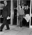  ??  ?? Stiff and limping, the 19-year-old arrives back in London after being grilled by the FBI in Los Angeles. Photograph: Getty Images