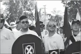  ?? ASSOCIATED PRESS ?? IN THIS SATURDAY, AUG. 12, 2017 PHOTO, James Alex Fields Jr., second from left, holds a black shield in Charlottes­ville, Va., where a white supremacis­t rally took place. Fields was later charged with second-degree murder and other counts after...