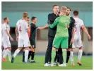  ??  ?? Unity…Hjulmand embraces keeper Kasper Schmeichel