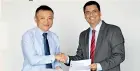  ??  ?? From left: Hambantota Internatio­nal Port Group CEO Ray Ren exchanging agreement with NYK Lanka Director Sagara Peiris