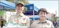  ?? RITA GREENE/MCDONALD COUNTY PRESS ?? From left: Timothy Thurman, Jr. of Noel, left, and Korbin Childers of Anderson, Boy Scouts of America, selling goodies at the Oktoberfes­t Saturday at Pineville Square.