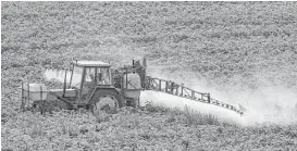  ?? Philippe Huguen / AFP / Getty Images file ?? A farmer sprays a field in Meteren, France. The EU’s long deliberati­ons on the world’s top-selling herbicide have frustrated parties on all sides.